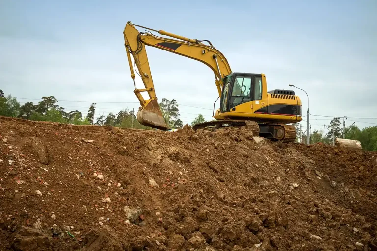 Excavator working on an enbankment